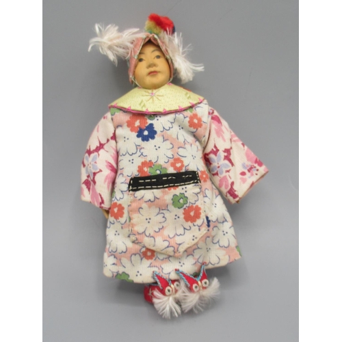 1255 - Chinese 'Door of Hope' child doll 1930s, carved pearwood with hand-embroidered costume, shoes and ta... 