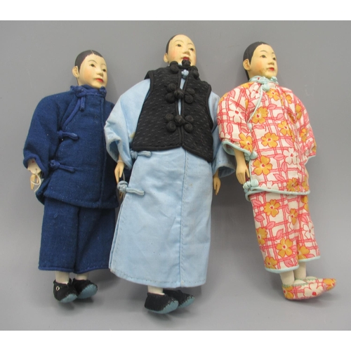 1250 - Three Chinese 'Door of Hope' dolls 1930s, carved pearwood, comprising two female dolls and one male,... 