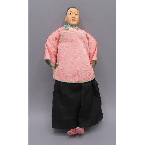 1257 - Chinese 'Door of Hope' doll 1930s, carved pearwood, modelled as a woman in black robe with pink jack... 