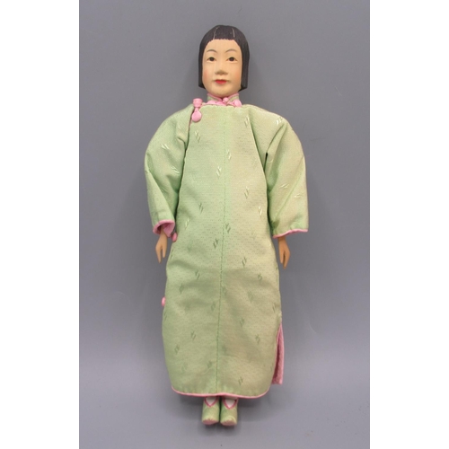 1258 - Chinese 'Door of Hope' doll 1930s, carved pearwood, modelled as a woman in green robe, H28cm