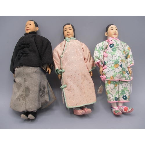 1249 - Three Chinese 'Door of Hope' dolls 1930s, carved pearwood, comprising two female dolls and one male,... 