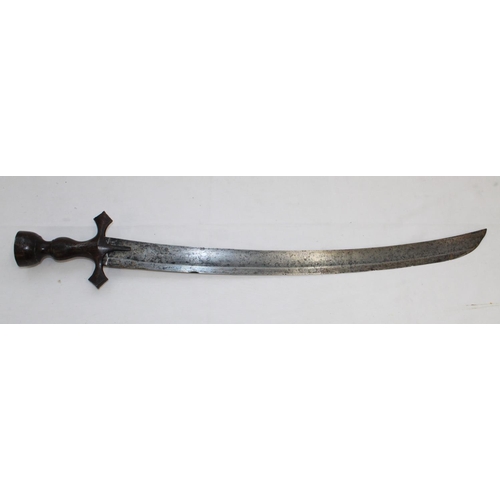 252 - Late C19 Tulwar sword. Lacking scabbard, handle in good order the blade shows signs of wear and use.... 