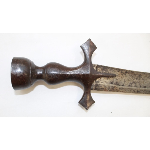 252 - Late C19 Tulwar sword. Lacking scabbard, handle in good order the blade shows signs of wear and use.... 