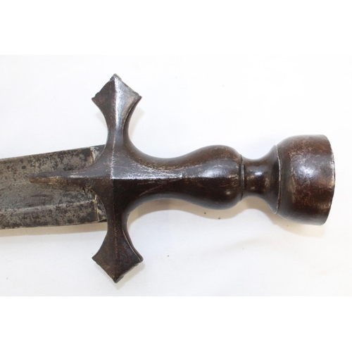 252 - Late C19 Tulwar sword. Lacking scabbard, handle in good order the blade shows signs of wear and use.... 