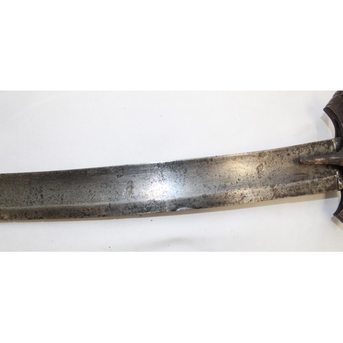 252 - Late C19 Tulwar sword. Lacking scabbard, handle in good order the blade shows signs of wear and use.... 