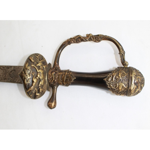 253 - Mid C18 German hunting sword, lacking scabbard. The Brass pommel, hand guard, and cross guard are em... 