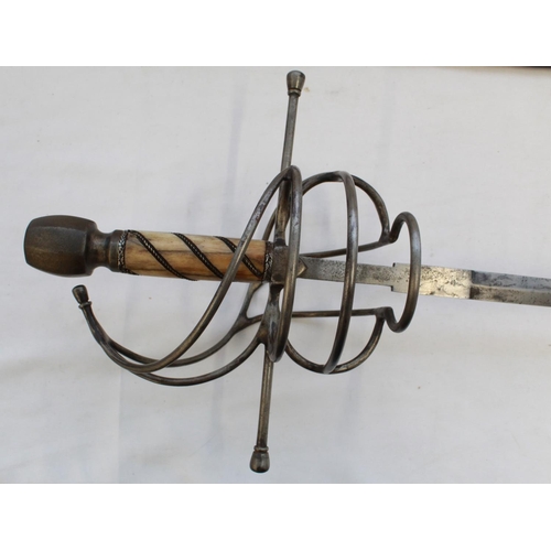 258 - Quality copy of a C17th style rapier. Bone handle and heavy steel pommel with large steel basket and... 