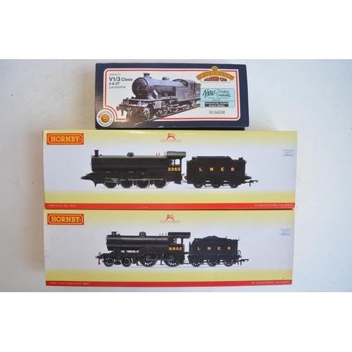 1082 - Three boxed OO gauge electric steam train models, all in LNER black liveries to include Hornby R3521... 