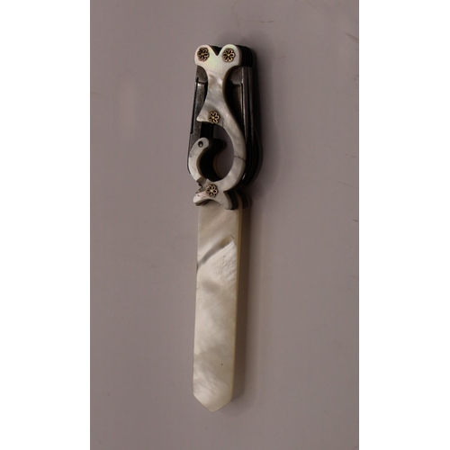 1101 - Victorian mother of pearl letter opener with quill blades, set in an unusual shaped handle with moth... 