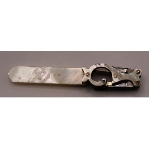 1101 - Victorian mother of pearl letter opener with quill blades, set in an unusual shaped handle with moth... 