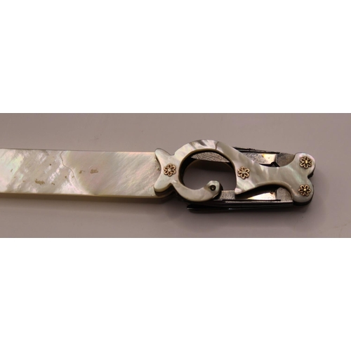 1101 - Victorian mother of pearl letter opener with quill blades, set in an unusual shaped handle with moth... 