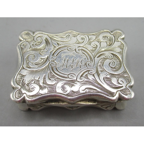 1077 - Victorian silver vinaigrette engraved with scrolling patterns, a monogrammed cartouche and a serpent... 