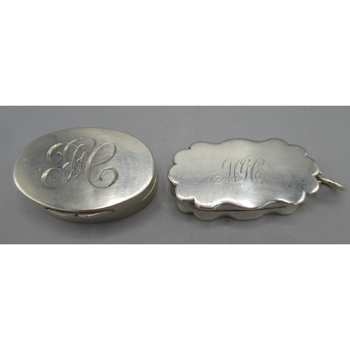 1055 - Edwardian silver oval vinaigrette, monogrammed lid, faded gilt interior with a pierced scrolling fol... 