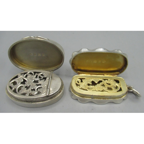 1055 - Edwardian silver oval vinaigrette, monogrammed lid, faded gilt interior with a pierced scrolling fol... 