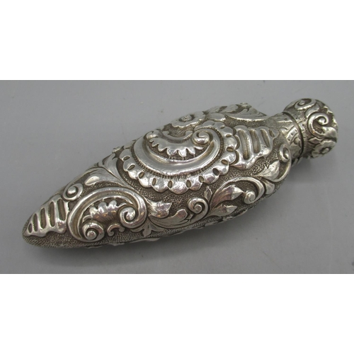 1074 - Victorian silver scent bottle cased in scrolling and foliate repousse decoration, hinged lid to reve... 