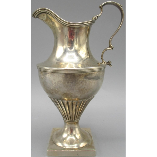 1057 - George III silver jug with square foot, part lobed urn style body and sweeping handle, London, 1805,... 