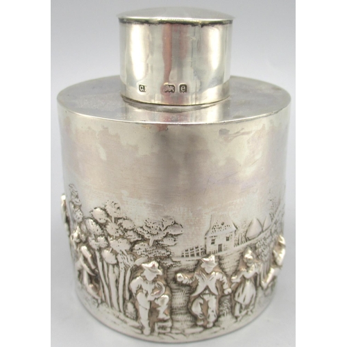 1073 - Edwardian silver tea caddy, cylindrical body decorated in a repousse country scene with figures and ... 