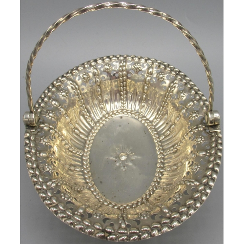 1046 - George III silver basket of oval form, pierced and embossed decoration with twisted swing handle, ra... 