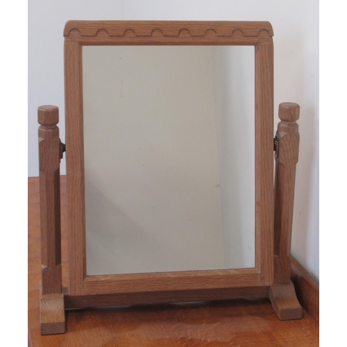 1375 - Robert Mouseman Thompson of Kilburn - an oak toilet mirror, rectangular plate with penny moulded fri... 