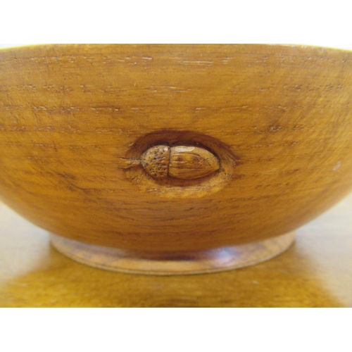 1395 - Acorn Industries of Brandsby - a turned oak circular fruit bowl, carved with signature acorn, D21cm