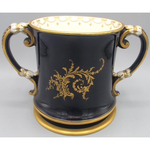 1195 - Large Royal Worcester two handled mug, painted in gilt scroll reserve panel with apples and grapes b... 