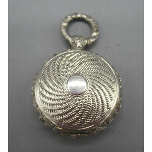 1053 - George IV silver fob vinaigrette in circular form, engine turned pattern, vacant cartouche, foliate ... 