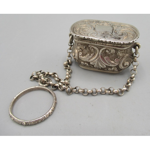 1047 - Victorian silver vinaigrette in the form of a handbag on a chain with finger ring handle, chased and... 