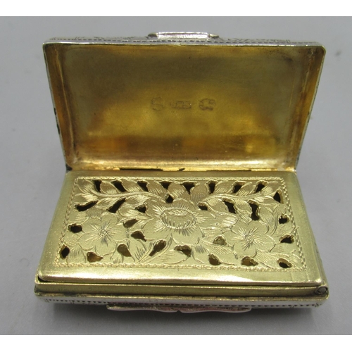 1052 - George III silver vinaigrette in the shape of a purse with chased decoration, gilt interior with fol... 