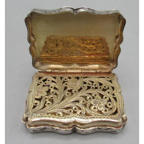 1060 - Victorian silver vinaigrette engraved with scrolling decoration, serpentine border, vacant cartouche... 