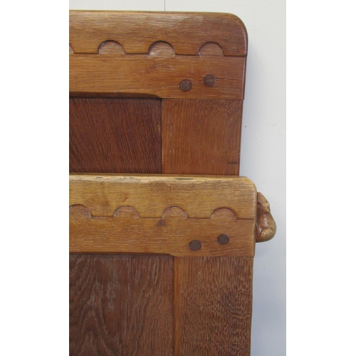 1368 - Robert Mouseman Thompson of Kilburn - an oak bedstead, head and footboards with fourteen adzed panel... 