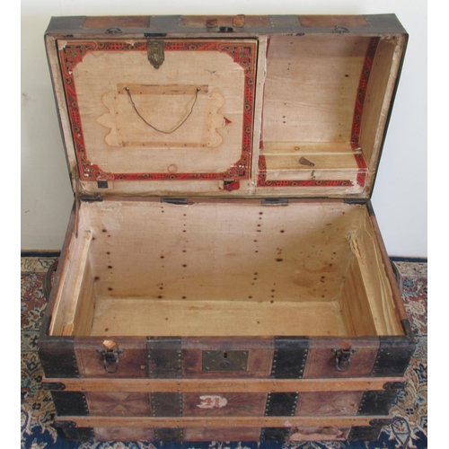 1427 - Victorian metal and wood strap bound leather covered dome top travelling trunk, with fitted interior... 