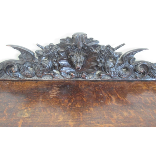 1422 - Victorian oak side table, the raised pierced back carved with mask heads and scrolls, the two frieze... 