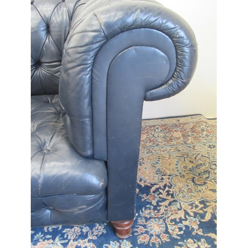 1420 - Victorian Chesterfield sofa, later reupholstered in buttoned blue leather, on turned supports, W190c... 