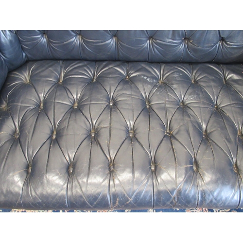 1420 - Victorian Chesterfield sofa, later reupholstered in buttoned blue leather, on turned supports, W190c... 