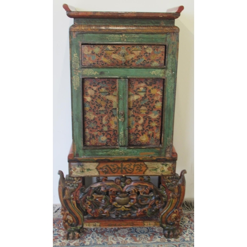 1433 - Small 19th century Tibetan carved polychrome painted side cabinet with drawer above two doors, on sh... 