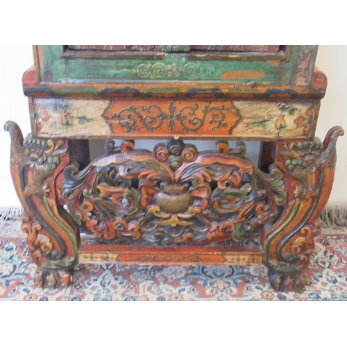 1433 - Small 19th century Tibetan carved polychrome painted side cabinet with drawer above two doors, on sh... 