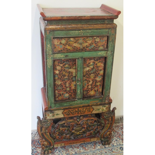 1433 - Small 19th century Tibetan carved polychrome painted side cabinet with drawer above two doors, on sh... 