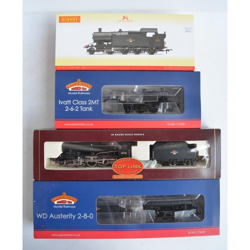 1085 - Four boxed OO gauge electric steam train models, all in BR black late crest livery to include Hornby... 