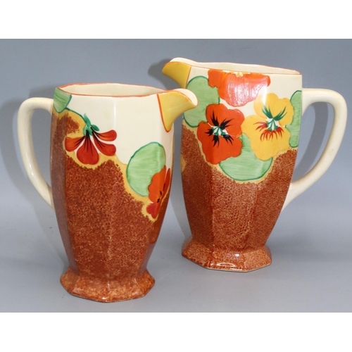 1163 - Clarice Cliff, two Nasturtium pattern Athens shape water jugs, hand painted with band of flowers and... 