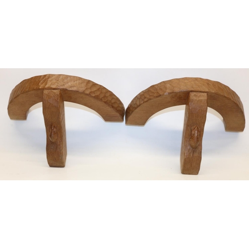 1379 - Robert Mouseman Thompson of Kilburn - a pair of demi-lune adzed oak wall lights, shaped support carv... 