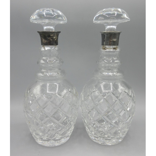 1048 - Pair of Georgian cut glass decanters with silver mounts and mushroom stoppers, hallmarks rubbed, one... 