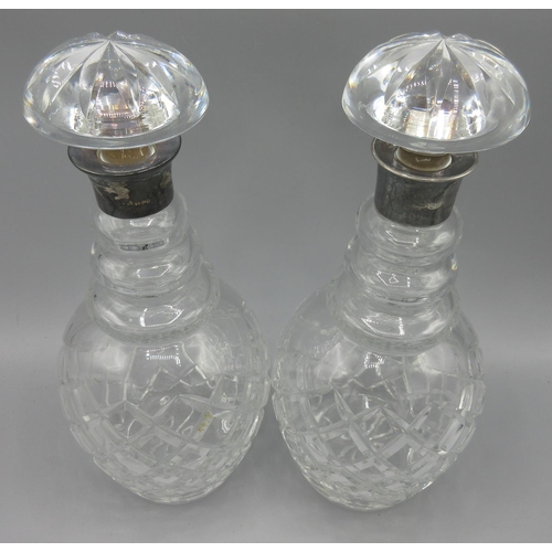 1048 - Pair of Georgian cut glass decanters with silver mounts and mushroom stoppers, hallmarks rubbed, one... 