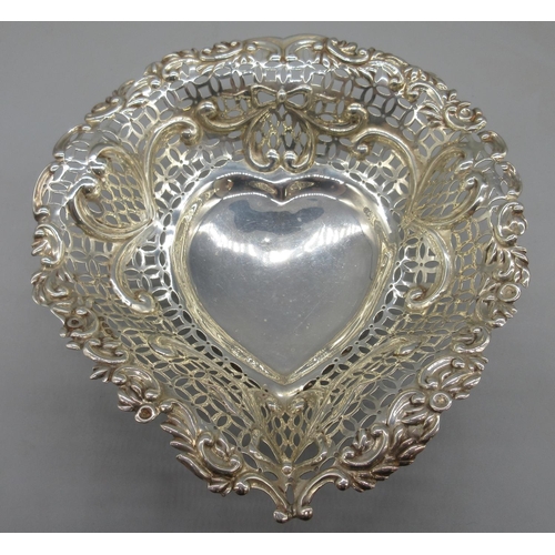 1065 - Victorian silver pierced heart shaped dish decorated with bows, hearts and swags, Chester, 1895, 6.4... 