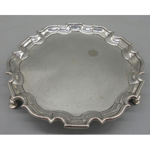 1034 - George II silver circular card tray, raised pie crust border on three hoof feet by Joseph Sanders, L... 