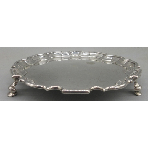 1034 - George II silver circular card tray, raised pie crust border on three hoof feet by Joseph Sanders, L... 