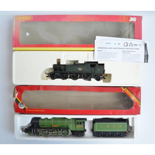 1115 - Three boxed OO gauge electric steam train models from Hornby to include R2785 BR green Class 9F 9222... 