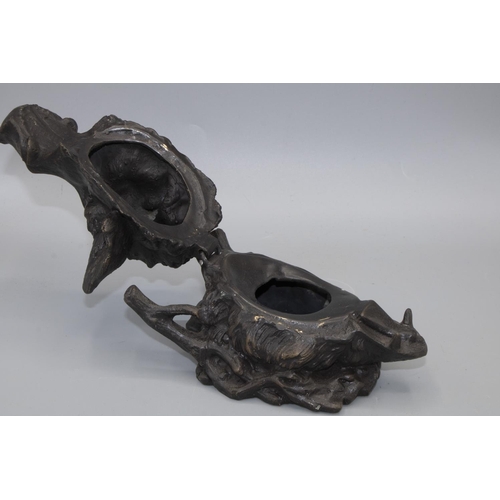 1093 - After Barrie - a patinated cast metal inkwell in the form of a boars head, with hinged jaw and natur... 