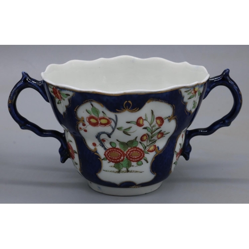 1207 - 18th century Worcester porcelain two-handled chocolate cup and saucer, painted with chrysanthemums i... 