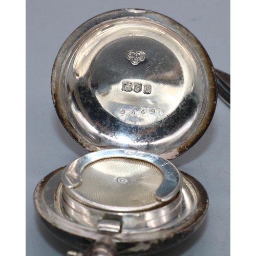 1069 - George V silver Sovereign case, plain circular with suspension loop, by Goldsmiths & Silversmiths Co... 