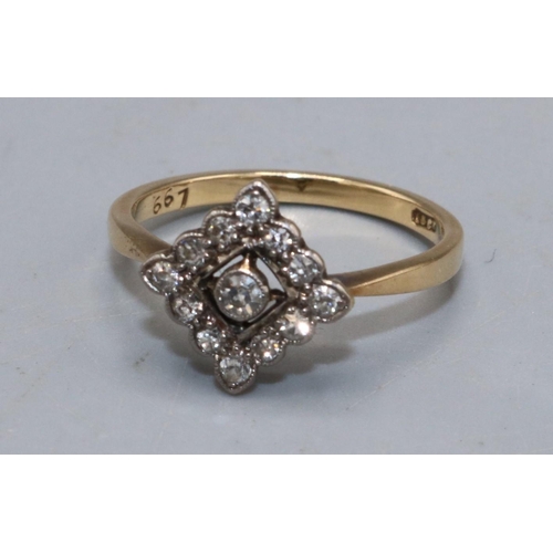 1003 - 18ct yellow gold ring set with diamonds, the central stone surrounded  by a diamond border, on plain... 